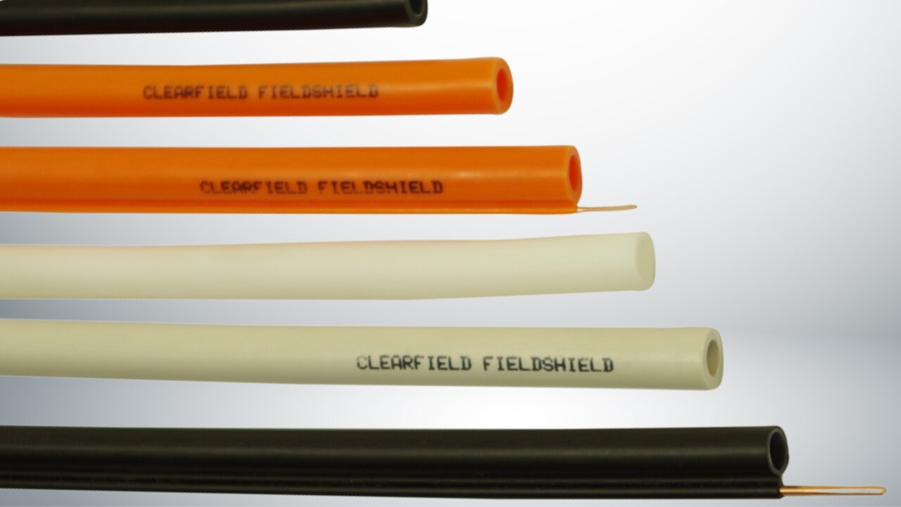 Clearfield FieldShield microduct in orange, cream, and black.
