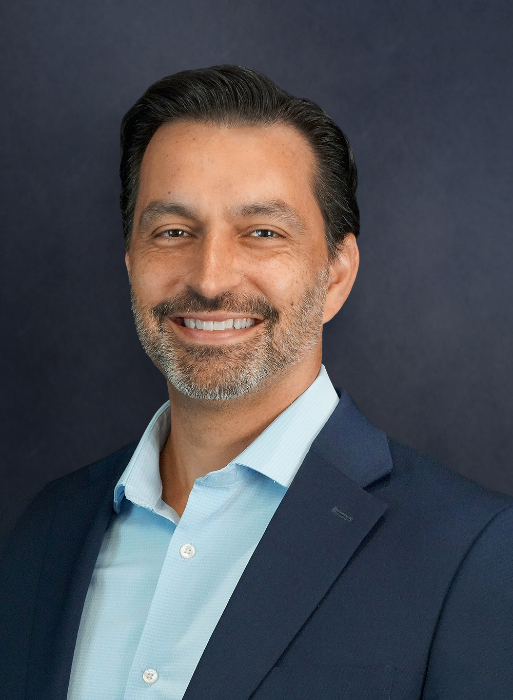 Portrait of a man in a navy blazer