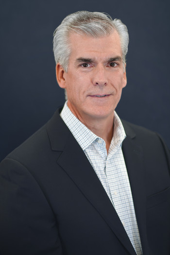Portrait of a man in a suit.