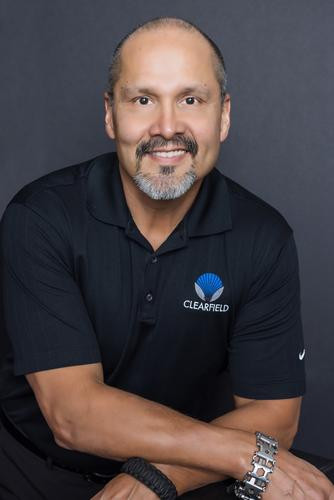 Portrait of a man wearing a black polo shirt with the Clearfield logo.